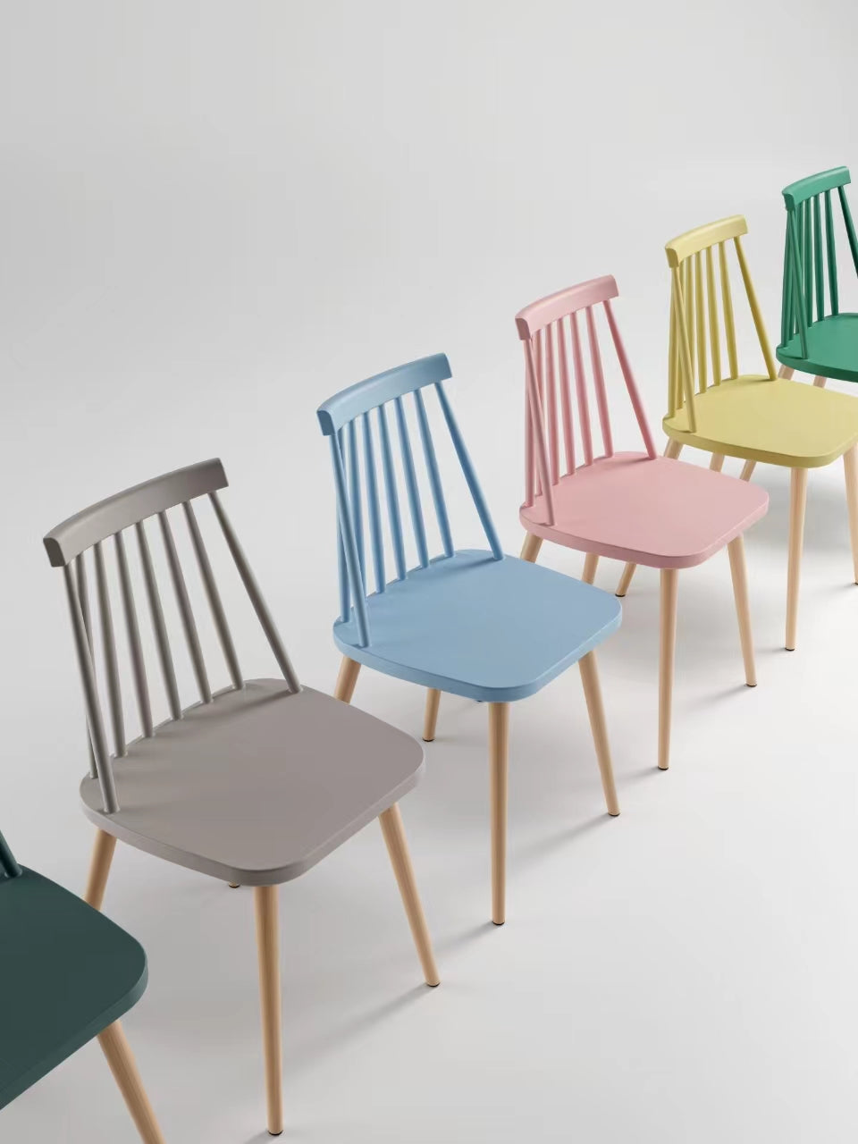 Carlsbad modern Windsor dining chairs in multiple pastel colors with wood-textured metal legs, contemporary minimalist seating