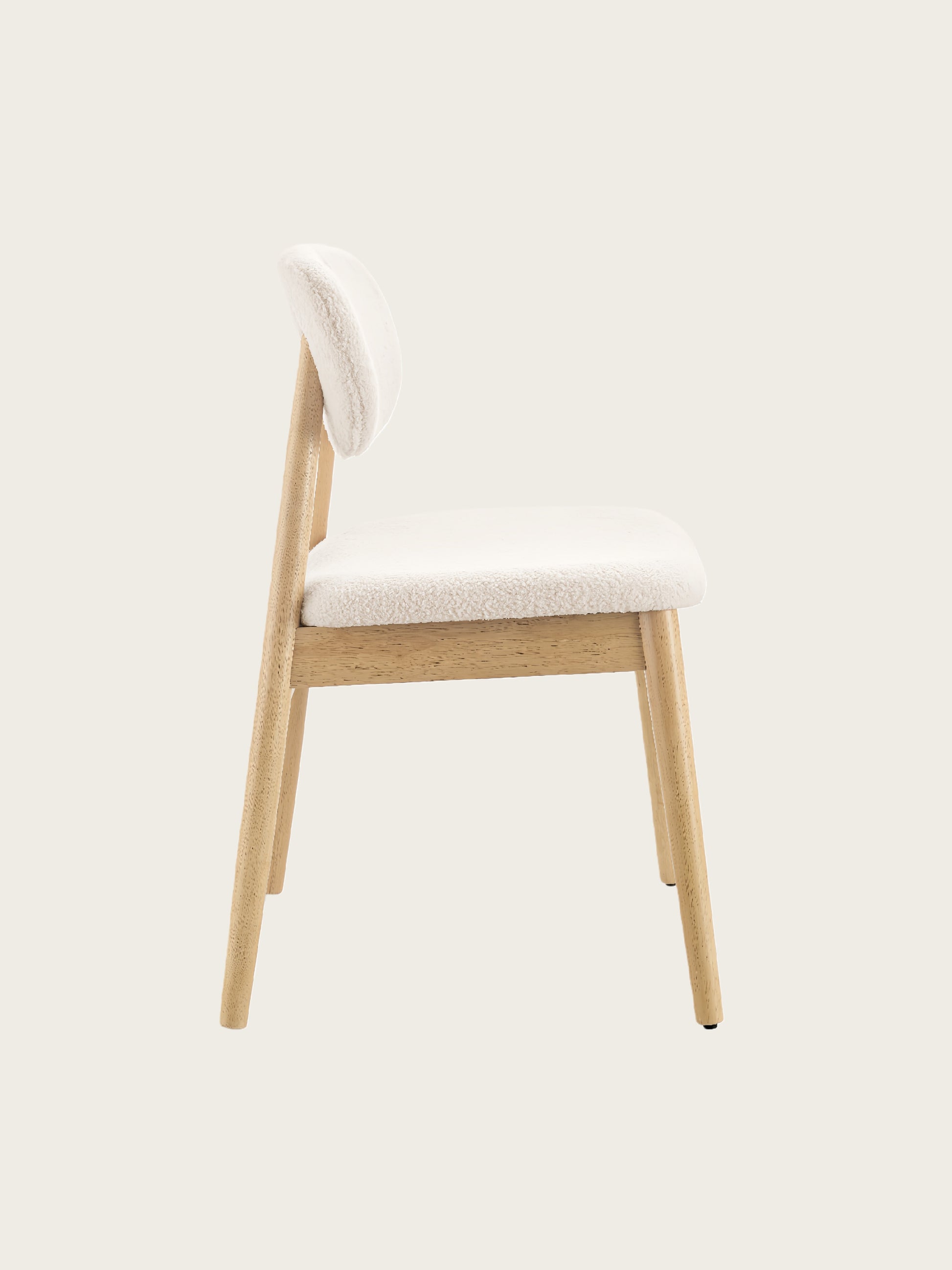 Side view of Xdeco Del Mar dining chair with teddy boucle upholstery and solid rubberwood frame
