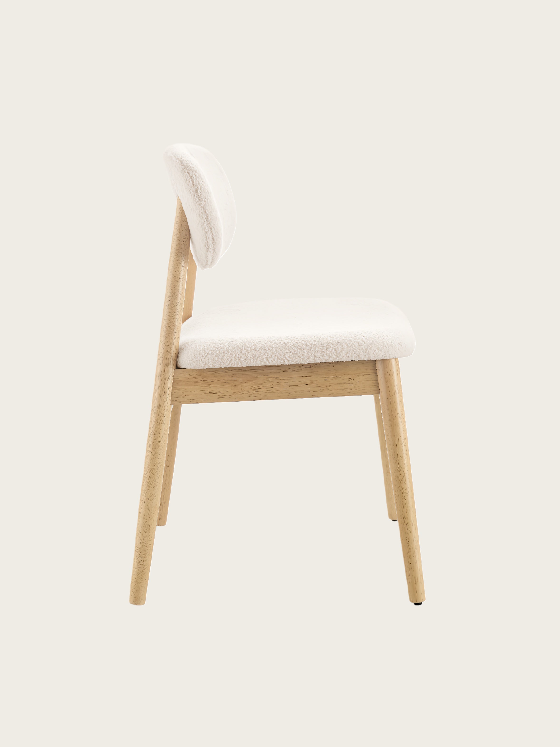 Side view of Xdeco Del Mar dining chair with teddy boucle upholstery and solid rubberwood frame