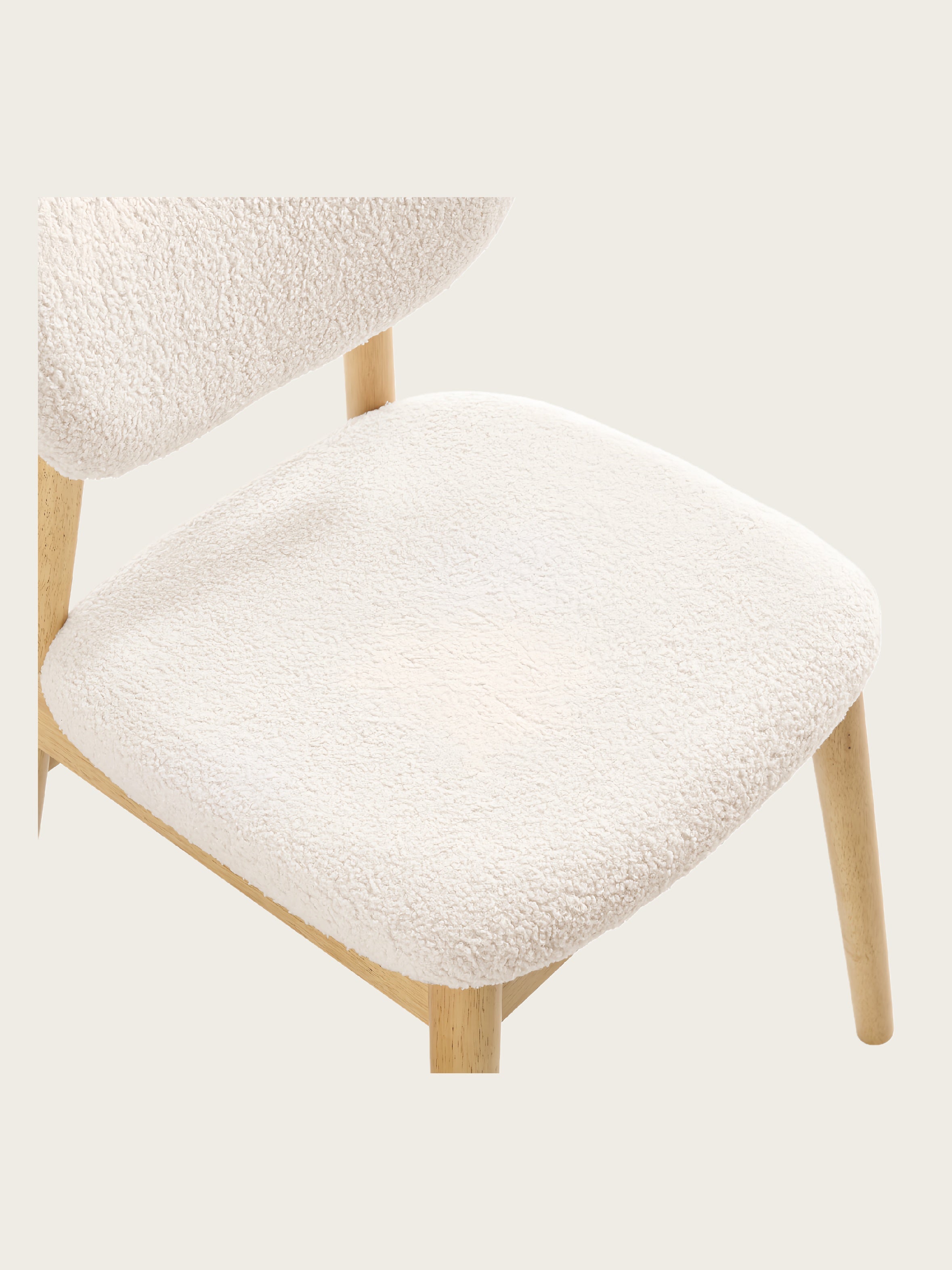 Detail view of Del Mar dining chair with textured white teddy boucle fabric and solid wood frame