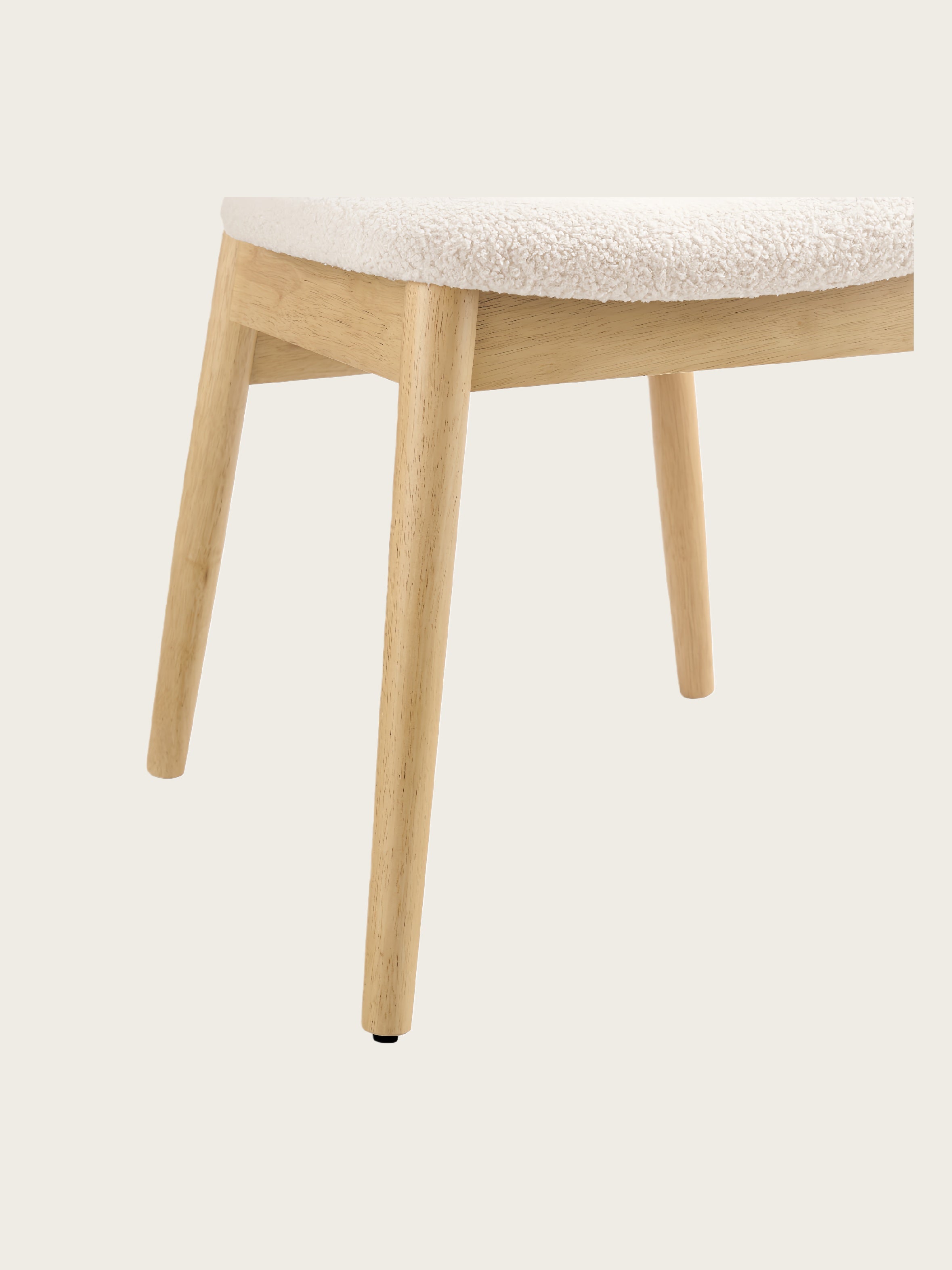 Close-up of Del Mar dining chair showing solid rubberwood legs and clean wooden frame construction