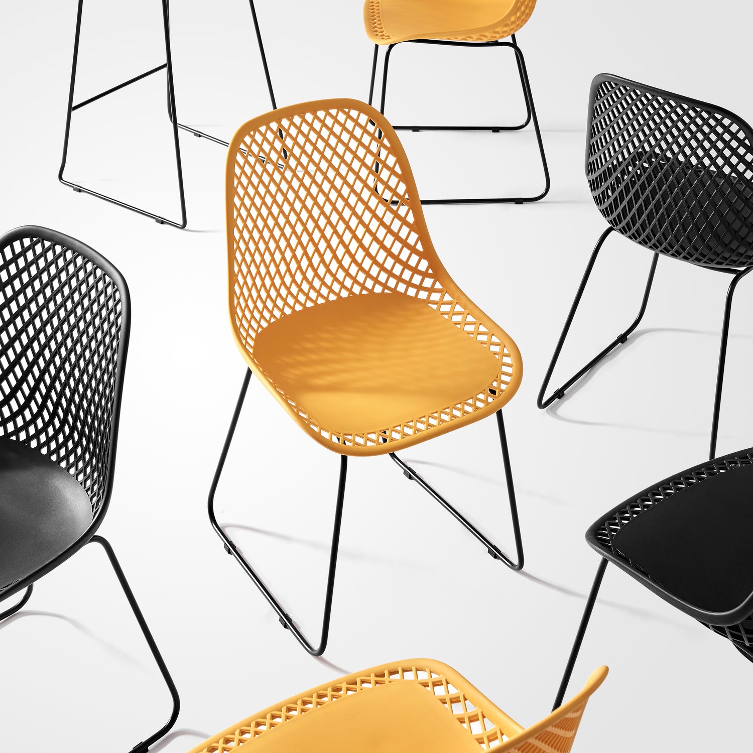 Griffith Collection modern woven chairs in black and yellow with sculptural metal legs